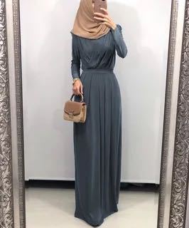 Flowy milk silk abaya dress with long sleeves and a modern hijab, perfect for modest fashion styling.