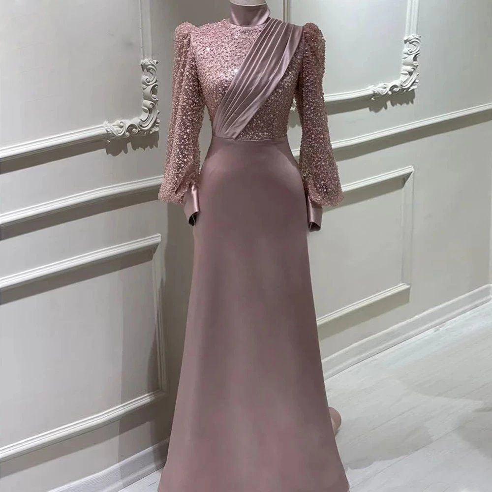 Beaded satin abaya evening dress featuring a structured stand collar and long sleeves, showcasing elegant modest fashion.